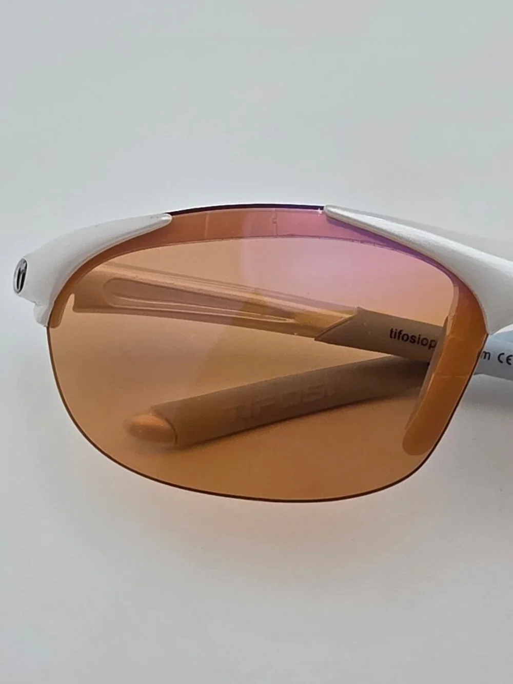 Tifosi Wisp Pearl White Baby Blue Frame Purple Mirror Lens Rimless Sunglasses